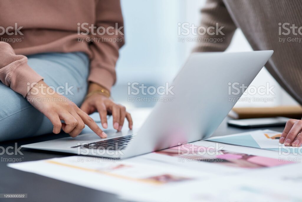 Shot of an unrecognizable man and woman using a laptop while working from home